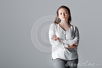 Attractive, confident overweight girl posing with Stock Photo