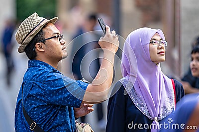 Attractive couple going out, romantic asian couple having fun. Cambridge, UK, August 1, 2019. Editorial Stock Photo