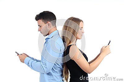 Attractive couple typing in their mobile phones Stock Photo