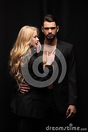 Attractive curly woman touching handsome man Stock Photo
