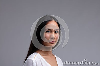 Attractive dark haired woman with a serene expression Stock Photo