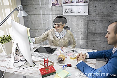 Attractive designer is discussing Stock Photo