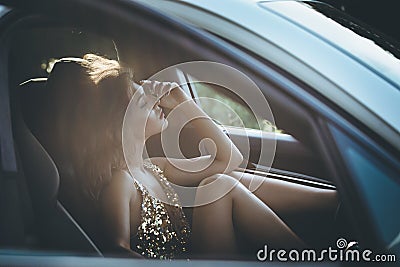 Attractive elegant woman inside car Stock Photo