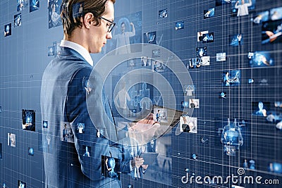 Attractive european businessman using pad with connecting businesspeople Stock Photo