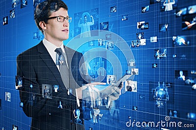 Attractive european businessman using tablet with connecting businesspeople Stock Photo