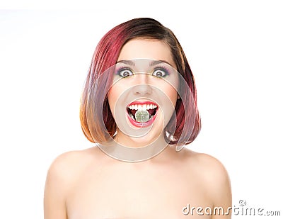 Attractive excited girl with colored hair having candy in mouth Stock Photo