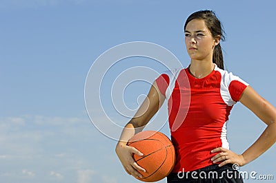 Attractive female holding a basketball Stock Photo