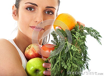 Attractive female holds bunch of fruit and veg Stock Photo