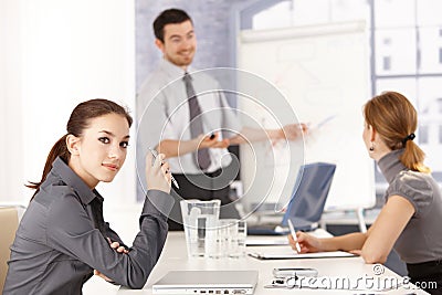 Attractive female listening to presentation Stock Photo