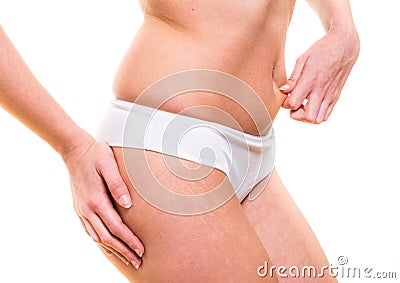 Attractive female pinching skin of her belly Stock Photo
