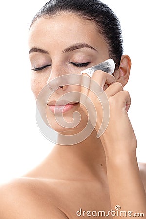 Attractive female removing eye make up Stock Photo