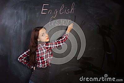 Attractive female teacher giving an English lesson Stock Photo