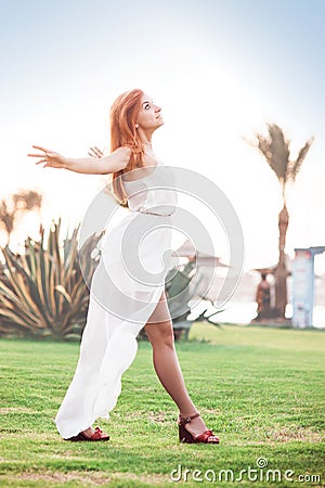 Attractive girl dressed in white waiting to the rain Stock Photo