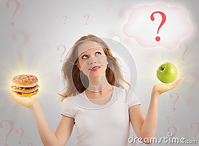 Attractive girl, healthy and unhealthy food Stock Photo