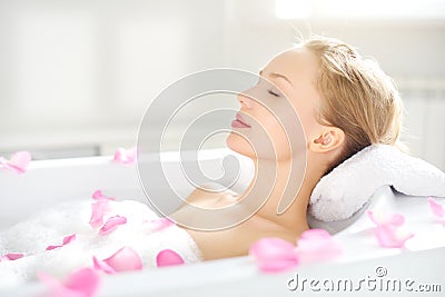 An Attractive girl relaxing in bath Stock Photo