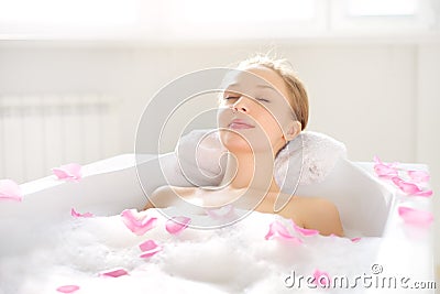 An Attractive girl relaxing in bath Stock Photo