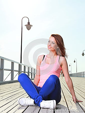 Attractive girl Young woman pier sea Stock Photo