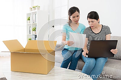 Attractive girls received online shopping parcel Stock Photo