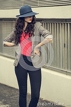 Attractive glamorous brunette wearing stylish clothes posing Stock Photo