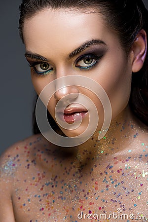 attractive glamorous model posing with glitter on body Stock Photo