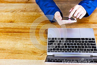 Attractive handsome businessman is using smart phone for working Stock Photo