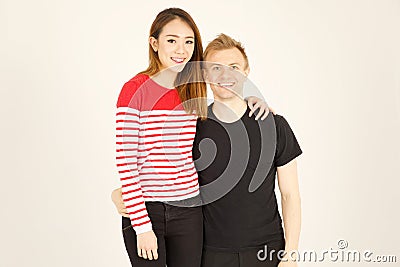 Attractive inter racial couple being close together Stock Photo