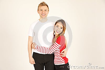Attractive inter racial couple being close together Stock Photo