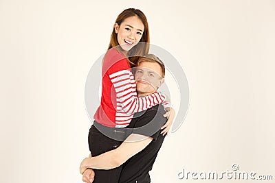 Attractive inter racial couple being close together Stock Photo