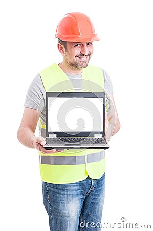 Attractive male constructor showing laptop with empty screen Stock Photo