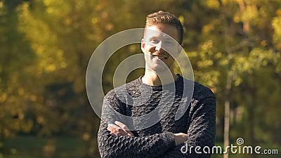 Attractive male laughing and looking at camera, posing for dating agency profile Stock Photo