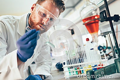 Attractive student of chemistry working in laboratory Stock Photo