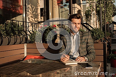 Businessman working at the table in open coffee Stock Photo