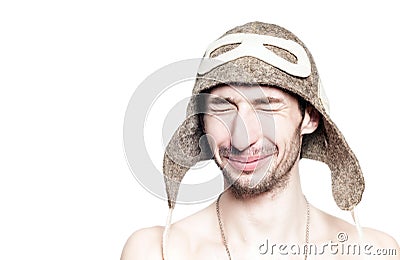 Attractive man portrait resting in russian bath with hat on head. Stock Photo