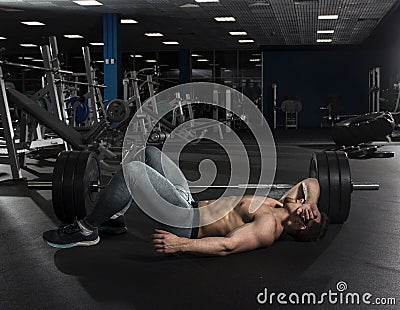 Attractive muscular shirtless bodybuilder taking the break from Stock Photo