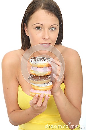 Attractive Natural Young Woman Holding a Pile of Iced Donuts Stock Photo