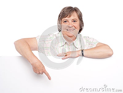 Attractive old woman indicating towards billboard Stock Photo