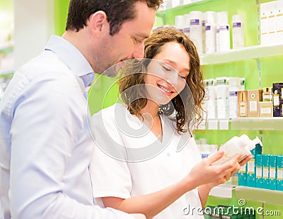 Attractive pharmacist advising a patient Stock Photo