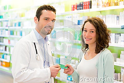 Attractive pharmacist advising a patient Stock Photo