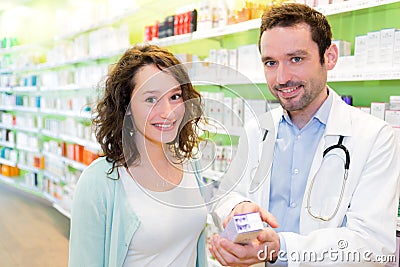 Attractive pharmacist advising a patient Stock Photo