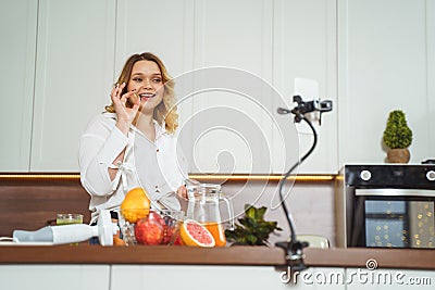 Attractive plump girl showing her gel vitamin Stock Photo