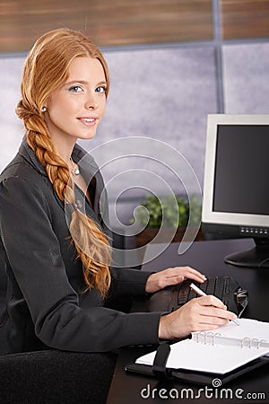 Attractive Redhead Businesswoman At Work Royalty Free 