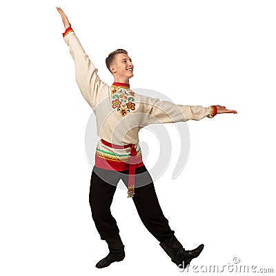 Attractive russian guy dancing in folk costume isolated on white Stock Photo