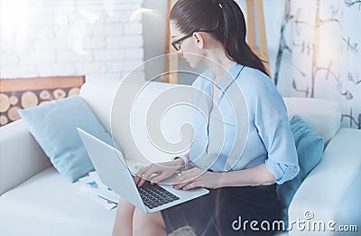 Attractive self employed businesswoman working on the laptop Stock Photo