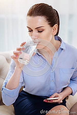 Attractive self employed woman having water Stock Photo