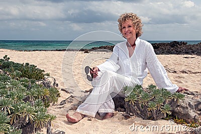 Attractive Senior Woman on Beach Stock Photo