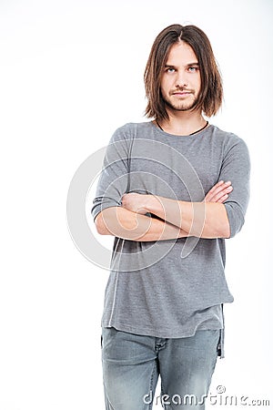 Attractive serious young man with long hair Stock Photo