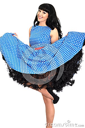 Attractive Cheeky Young Vintage Pin-Up Model Posing In Retro Polka Dot Dress Stock Photo