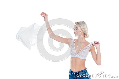 attractive girl in bra throwing away clothes, Stock Photo