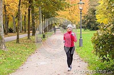 Attractive shapely young woman out jogging Stock Photo