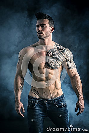 Attractive shirtless muscle man in studio Stock Photo